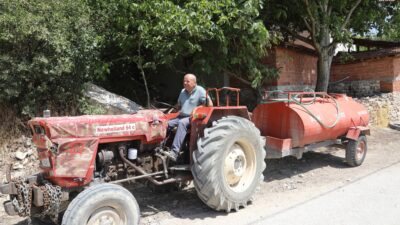 Bozbey, patlak lastikle 40 km yol alıp yangına su taşıyan
